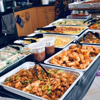 A table of Vietnamese and Asian catering trays from Co Hoang Catering in San Jose